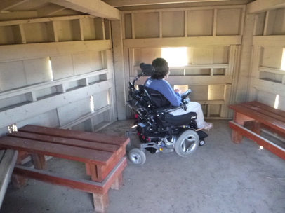 Interior of the accessible photo blind overlooking wetland - open windows - moveable benches